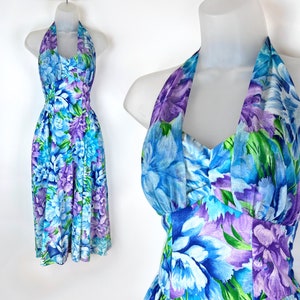 May include: A blue and purple floral print halter dress with a fitted bodice and a flowing skirt.