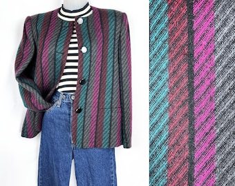 May include: A striped blazer with a teal, pink, and gray pattern. The blazer has a mandarin collar and three black buttons.