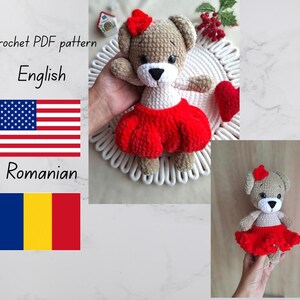 May include: A crocheted teddy bear with a red bow and a red skirt. The bear has a white muzzle and is holding its arms out. The image also includes the text "Crochet PDF pattern" and the words "English" and "Romanian" with the flags of the United States and Romania.