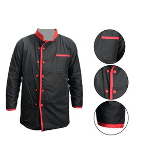 May include: Black chef's jacket with red detailing. The jacket has a mandarin collar and a single breast pocket. Red trim accents the cuffs and front edges. The jacket is fastened with red buttons.