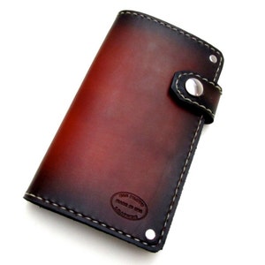Cartera de cuero Sunburst con cierre lateral a presión