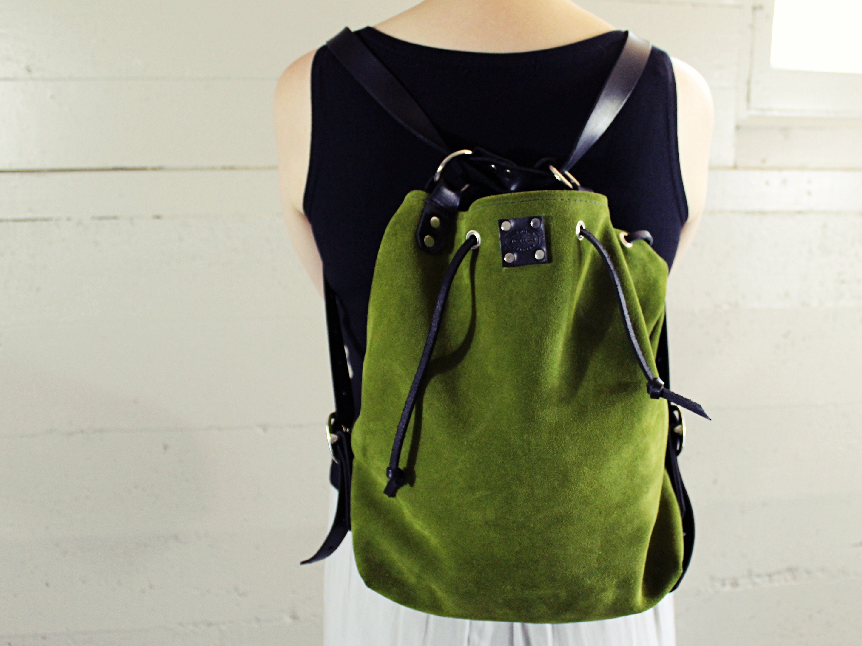 green suede backpack