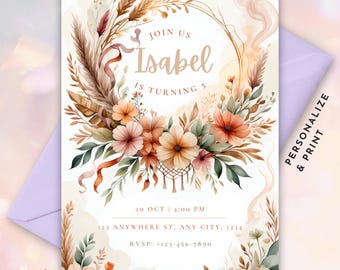May include: A printable invitation for a 5th birthday party with a bohemian theme. The invitation features a watercolor illustration of a floral wreath with a dreamcatcher in the center. The text "Join us Isabel is turning 5" is written in a gold script font. The invitation also includes the date, time, and location of the party.