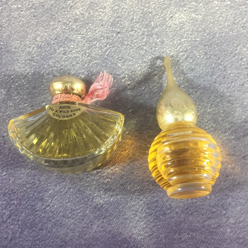 Avon Wild Rose Fan-Shaped Bottle and Other Round Glass Ribbed Bottle with Gold Dome Top