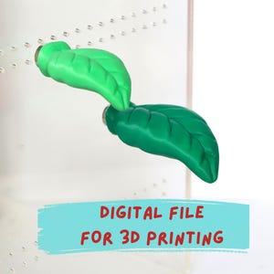 Puede incluir: Dos objetos con forma de hoja en verde claro y verde oscuro sujetos a un panel acrílico transparente con pequeños orificios. Una banda azul claro en la parte inferior muestra el texto en rojo DIGITAL FILE FOR 3D PRINTING.