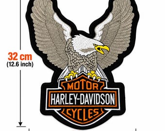 May include: A large embroidered patch featuring a bald eagle with spread wings perched atop a Harley-Davidson Motor Cycles logo. The patch measures 12.6 inches in height and 9.4 inches in width, with black, white, grey, and yellow thread colors.