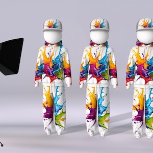 May include: Three white mannequins wearing white hooded sweatshirts with colourful paint splatter designs. Each mannequin is wearing a white baseball cap. The mannequins are standing on a white surface in front of a white wall. A black light reflector is on a tripod to the left of the mannequins. A laptop computer is on a table to the right of the mannequins.