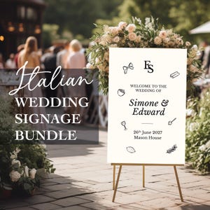 May include: A white wedding sign with black text and illustrations. The sign reads "Welcome to the wedding of Simone & Edward" and includes the date "26th June 2027" and the location "Mason House".