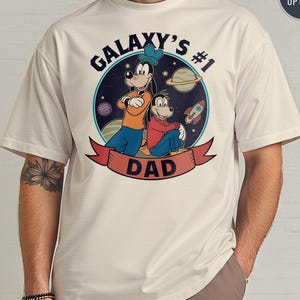 Galaxy’s #1 Dad Shirt Cartoon Space Theme Funny Father’s Day Tee Cute Gift for Cool Dads Who Love Space Adventure and Family Bonding