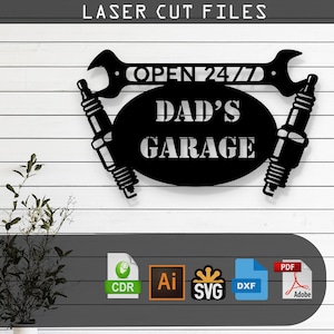May include: Black metal sign with the text "DAD'S GARAGE" in a cut-out oval shape, flanked by two spark plugs. The sign also features a wrench with the text "OPEN 24/7". The words "LASER CUT FILES" are at the top.