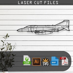 May include: A black and white line art illustration of a fighter jet, with the text "LASER CUT FILES" at the top of the image. Below the jet are icons for various file formats, including CDR, AI, SVG, DXF, and PDF.