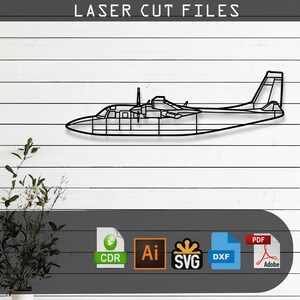 May include: A black metal outline of a twin-engine airplane mounted on a white wall. Above the plane, the text LASER CUT FILES is visible. Below, icons represent file formats including CDR, Ai, SVG, DXF, and PDF for digital download.