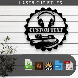 May include: Black laser-cut wall art featuring a turntable and headphones design. The words "CUSTOM TEXT" are displayed prominently. The art piece is surrounded by a decorative border. The words "LASER CUT FILES" are at the top.