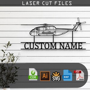 May include: Black metal helicopter wall art with the text "CUSTOM NAME" below the helicopter. The words "LASER CUT FILES" are at the top. Includes file format icons for CDR, AI, SVG, DXF, and PDF.