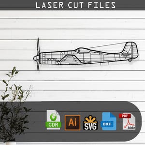 Può includere: Un contorno nero di aereo in metallo, un design tagliato al laser, montato su una parete di legno bianco. L'immagine include il testo "LASER CUT FILES" in alto e icone di tipo di file in basso.