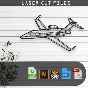 May include: Black metal laser cut file of a jet airplane. The image shows a detailed outline of the aircraft, including wings, engines, and tail. The text "LASER CUT FILES" is at the top. Below the jet are icons for CDR, AI, SVG, DXF, and PDF file formats.