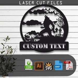 May include: A black laser cut file design featuring a circular silhouette of a werewolf howling at the moon, surrounded by bats, clouds, a tree, a ghost, and a witch. Below the circle is a banner with the text CUSTOM TEXT in white letters.