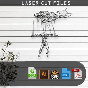 May include: A black and white geometric design of a person being controlled by a hand with strings. The design is on a white wood background. The image includes the text "LASER CUT FILES" and icons for CDR, AI, SVG, DXF, and PDF file formats.