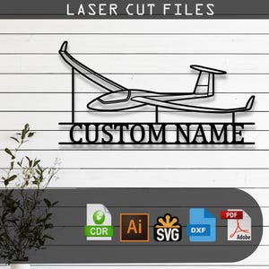 May include: A black laser cut file design featuring a glider aircraft silhouette positioned above the text CUSTOM NAME. The graphic includes file format icons for CDR, AI, SVG, DXF, and PDF, with the header text LASER CUT FILES at the top.