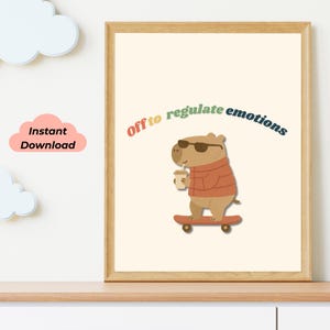 May include: A framed print featuring a cartoon capybara wearing sunglasses and a sweater, holding a coffee cup, and riding a skateboard. The text "Off to regulate emotions" arches above the capybara. The words "Instant Download" are in a pink cloud.