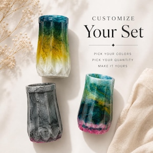 May include: Three faceted cylindrical vessels with marbled resin finishes in blue, yellow, white, gray, and pink. Text reads: CUSTOMIZE Your Set, PICK YOUR COLORS, PICK YOUR QUANTITY, MAKE IT YOURS. The containers have a textured, geometric exterior.