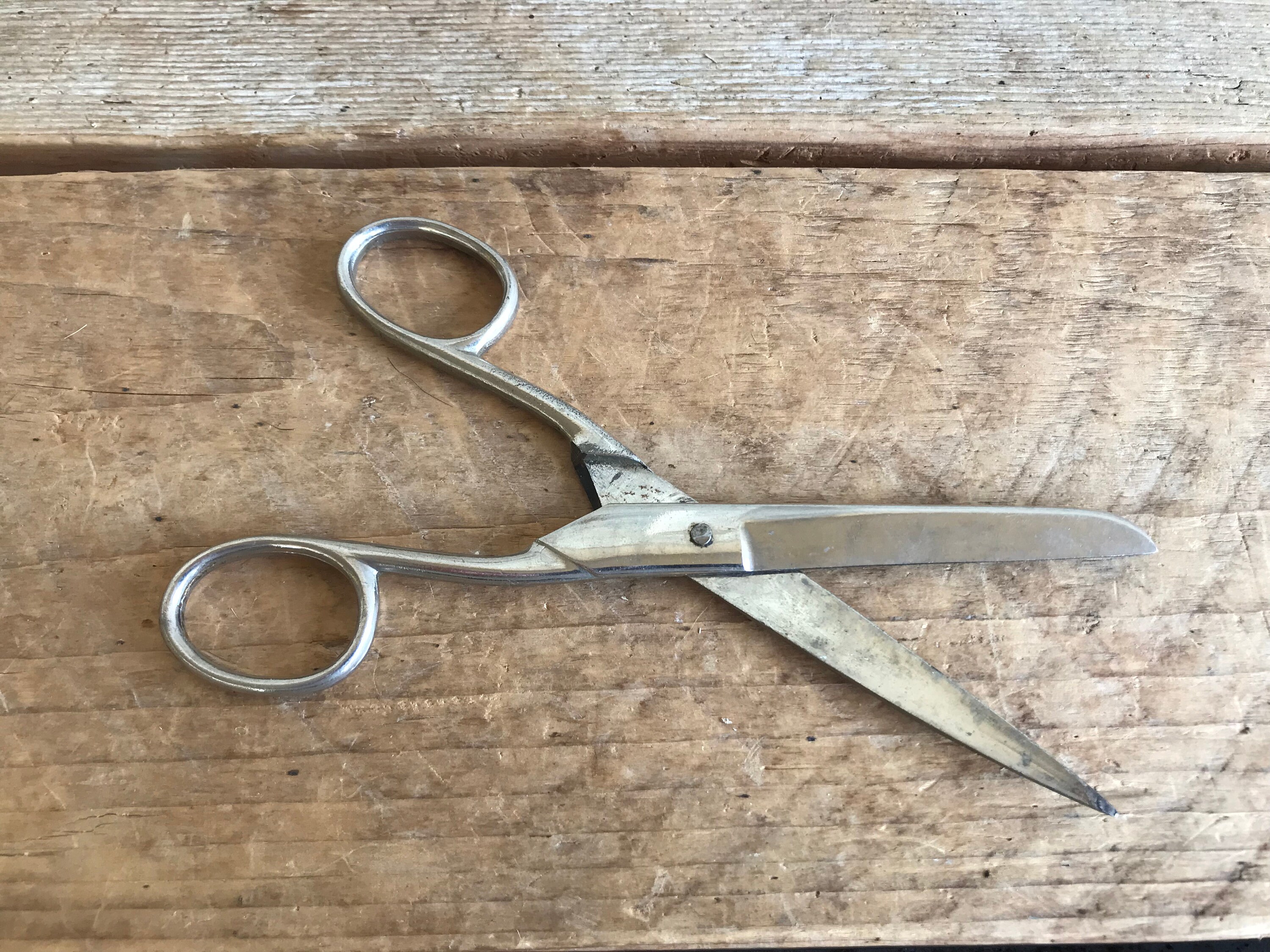 vintage household scissors isolated over white background