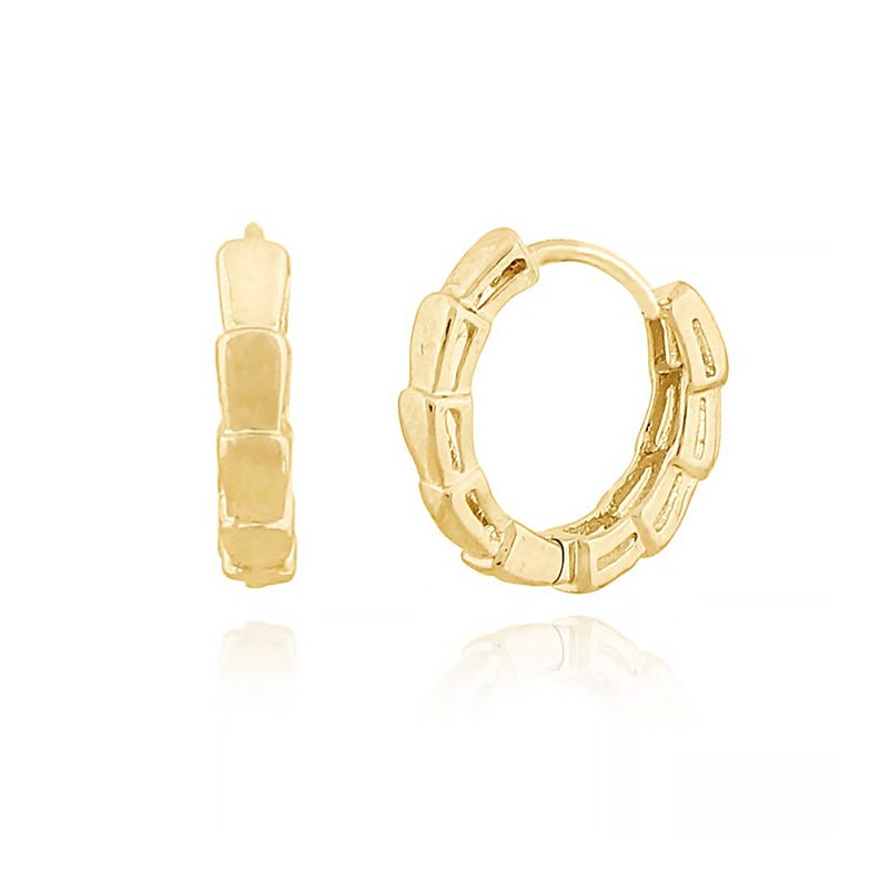 May include: A pair of gold-colored hoop earrings. Each earring features a segmented design, with rectangular links creating a textured appearance. The earrings are displayed on a white background, with a slight reflection visible below.