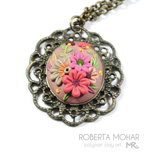 Items similar to Polymer clay floral embroidery applique pendant ...