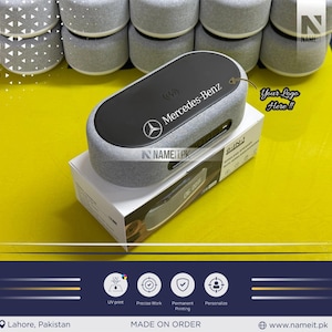 May include: A gray wireless speaker with the Mercedes-Benz logo and text. The speaker is on a white box with the text "6-IN-1 WIRELESS SPEAKER". The image also includes the text "Your Logo Here!!".