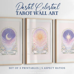 May include: Three framed pastel celestial tarot wall art prints. Each print features a different celestial body: the moon, the sun, and the stars. The prints are surrounded by floral and foliage elements. The text "Pastel Celestial Tarot Wall Art" is at the top.