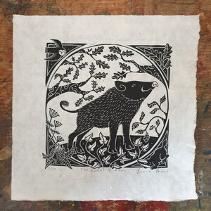 A full photo of Becca Thorne's Beast of Dean linocut. The print is black on cream-coloured handmade paper with hand-torn and deckled edges, and is signed and numbered by the artist.