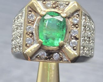 Engagment ring vavid green emerald with silver & gold ring