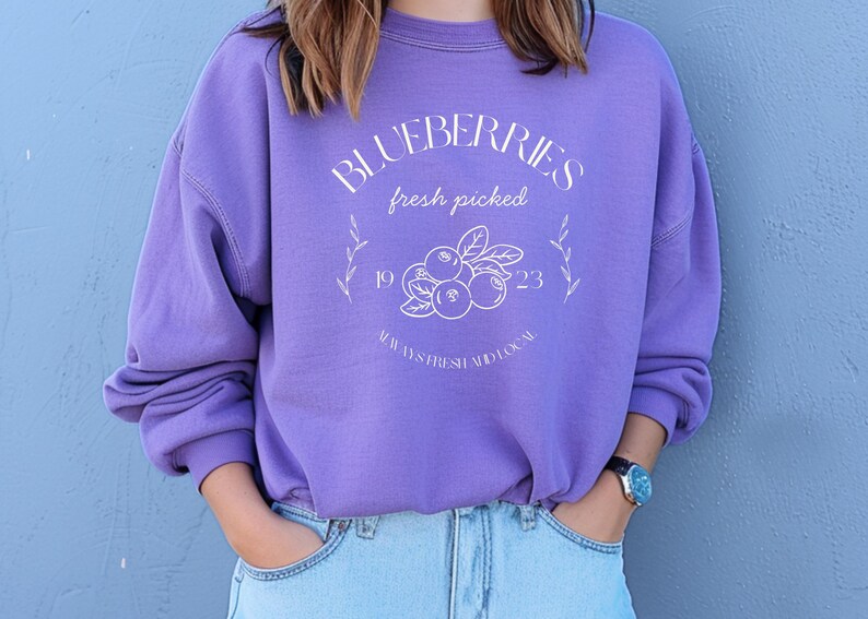 Printed on a soft-washed Comfort Colors 1566 crewneck, this sweatshirt has that lived-in feel right from the first wear. With its relaxed fit and pigment-dyed fabric, it pairs perfectly with your favorite denim, leggings, or cutoff shorts for a cozy-cute summer loo