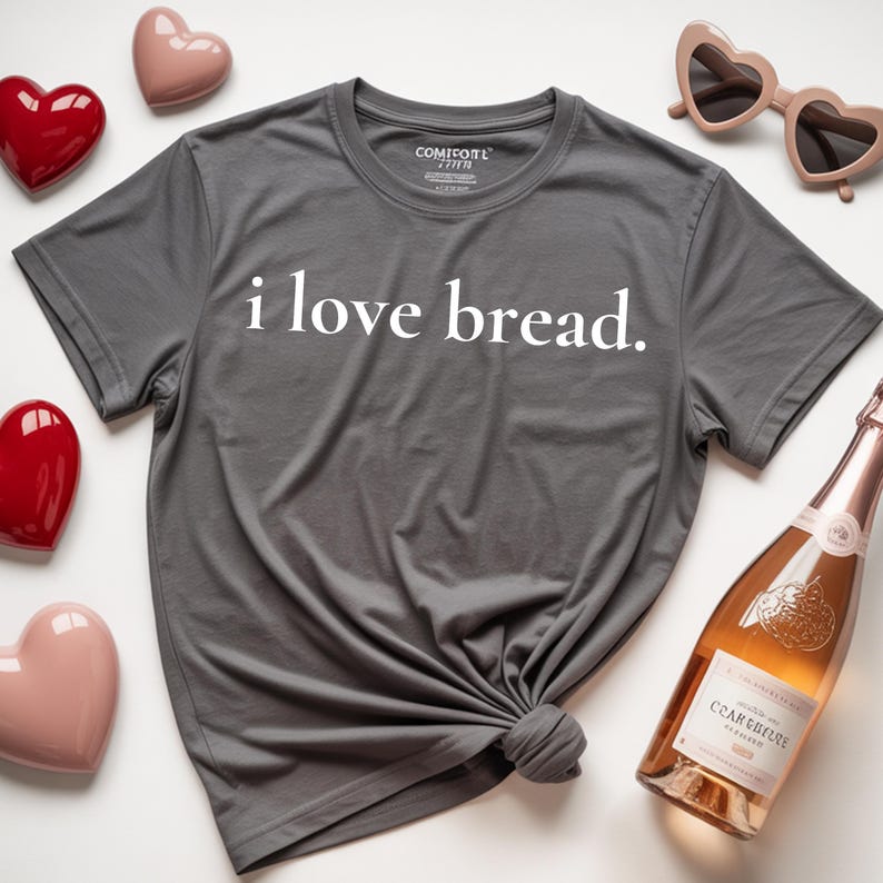 Simple. Honest. Relatable.
This “I Love Bread” Comfort Colors t-shirt is made for anyone who believes bread deserves more appreciation. Featuring clean, minimalist text and a soft, lived-in feel, this tee is the perfect blend of humor and everyday comfort.