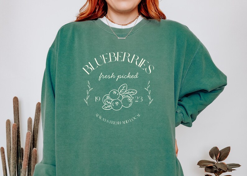 Printed on a soft-washed Comfort Colors 1566 crewneck, this sweatshirt has that lived-in feel right from the first wear. With its relaxed fit and pigment-dyed fabric, it pairs perfectly with your favorite denim, leggings, or cutoff shorts for a cozy-cute summer loo