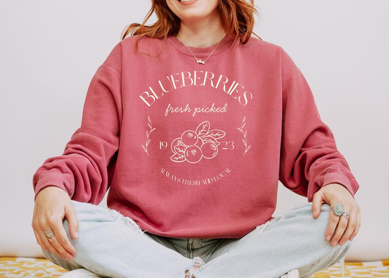 Printed on a soft-washed Comfort Colors 1566 crewneck, this sweatshirt has that lived-in feel right from the first wear. With its relaxed fit and pigment-dyed fabric, it pairs perfectly with your favorite denim, leggings, or cutoff shorts for a cozy-cute summer loo