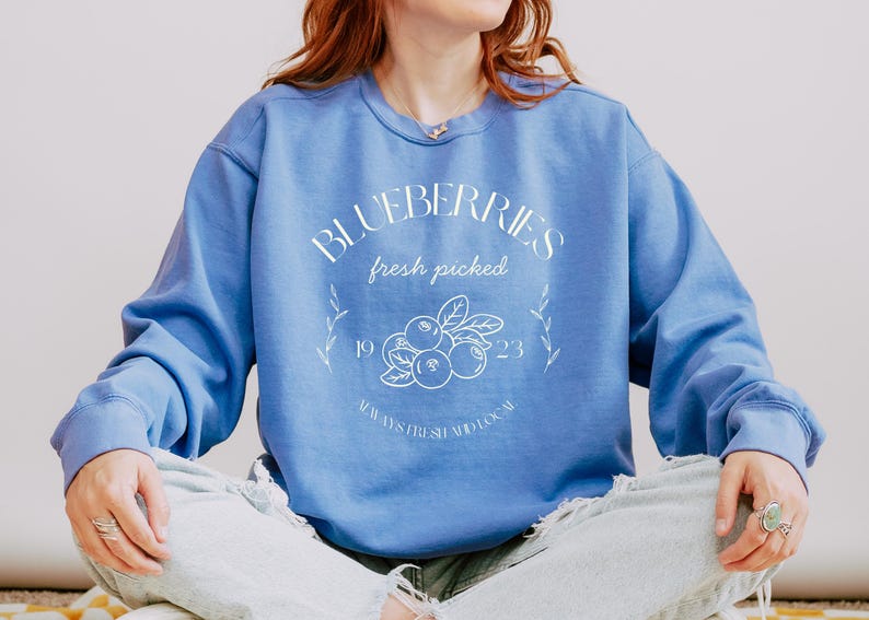 Printed on a soft-washed Comfort Colors 1566 crewneck, this sweatshirt has that lived-in feel right from the first wear. With its relaxed fit and pigment-dyed fabric, it pairs perfectly with your favorite denim, leggings, or cutoff shorts for a cozy-cute summer loo