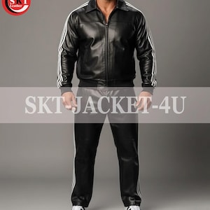 May include: Black leather jacket and pants set with white stripes. The jacket has a zip-up front and a collar. The pants have a straight leg design. The text "SKT JACKET-4U" is visible. The set is paired with white sneakers.