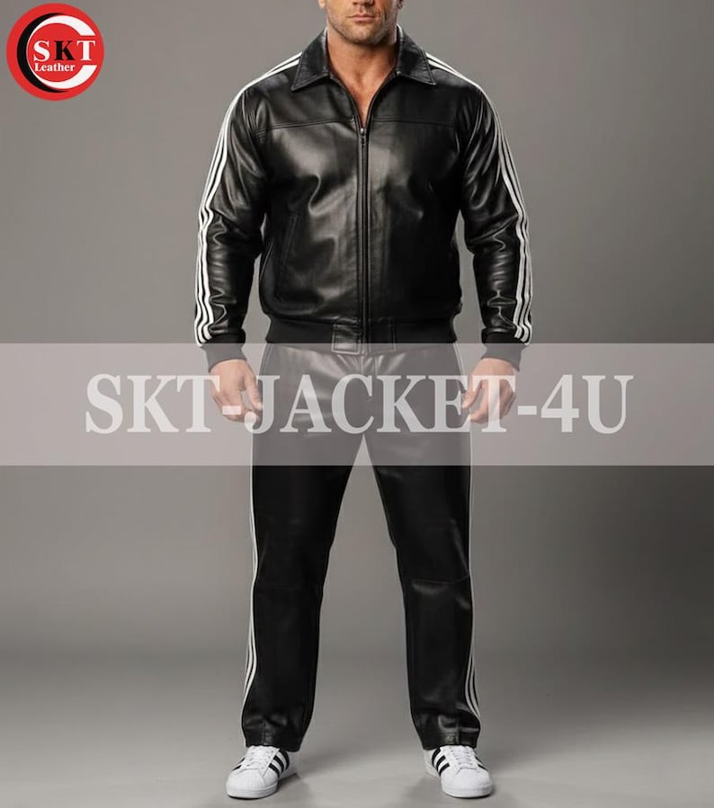 May include: Black leather jacket and pants set with white stripes. The jacket has a zip-up front and a collar. The pants have a straight leg design. The text "SKT JACKET-4U" is visible. The set is paired with white sneakers.
