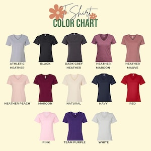 May include: A color chart displaying various V-neck t-shirts in different colors. Colors include athletic heather, black, dark grey heather, heather maroon, heather mauve, heather peach, maroon, natural, navy, red, pink, team purple, and white.