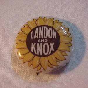 May include: A vintage political campaign button featuring a yellow sunflower with a black and white circle in the center. The text "LANDON AND KNOX" is printed in white on the circle.