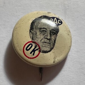May include: Vintage pinback button with a portrait of a man, likely a political figure. The button is off-white with a black and white portrait, the letters "OK" in a red circle, and the letters "PAC" in a blue circle.