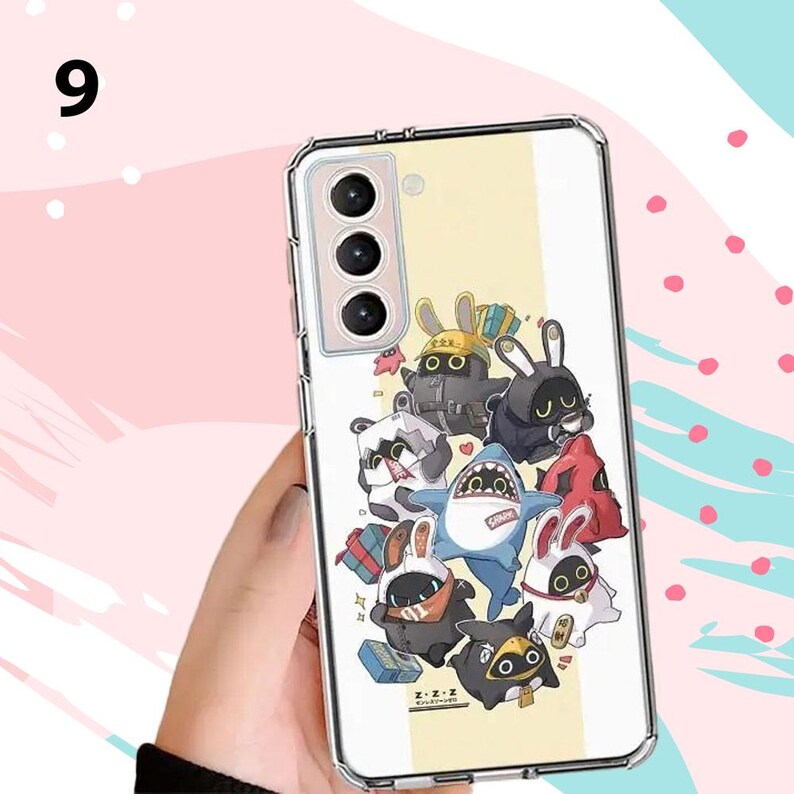 Puede incluir: Funda de tel&eacute;fono transparente con un dise&ntilde;o de dibujos animados de conejos y un tibur&oacute;n. El dise&ntilde;o incluye negro, blanco, rojo y amarillo. La funda del tel&eacute;fono la sostiene una persona.