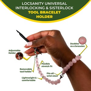 May include: A pink beaded tool bracelet holder with a black tool and adjustable holder. The bracelet is lightweight, comfortable, and fits all wrist sizes. The text on the image says "LOCSANITY UNIVERSAL INTERLOCKING & SISTERLOCK TOOL BRACELET HOLDER."