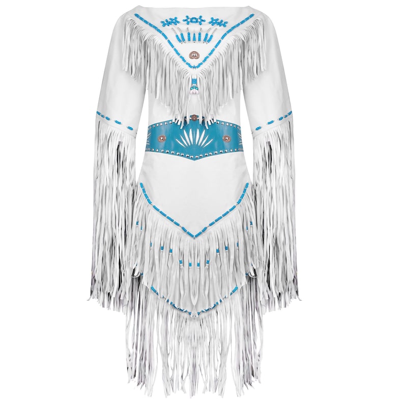 May include: White dress with long sleeves and fringe detailing. The dress features turquoise accents on the neckline, waist, and hem. The waist has a turquoise belt with a sunburst design. The dress has a Native American inspired design.