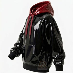 May include: A glossy black hoodie featuring a deep red interior hood lining and matching red drawstring cords. The garment has a front kangaroo pocket, long sleeves with black ribbed cuffs, and a black ribbed hem, showcasing a shiny finish.