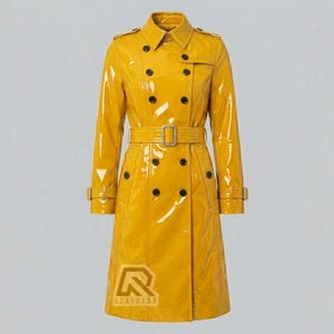 May include: A glossy, yellow trench coat with a double-breasted design, black buttons, and a matching belt. The coat features a classic collar, epaulets, and a logo at the bottom. The coat is a stylish outerwear garment.