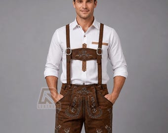 May include: A white long-sleeved button-down shirt paired with brown leather lederhosen featuring intricate embroidery, a front bib with decorative metal buckles, adjustable suspenders, and detailed deer motifs on the lower leg sections.