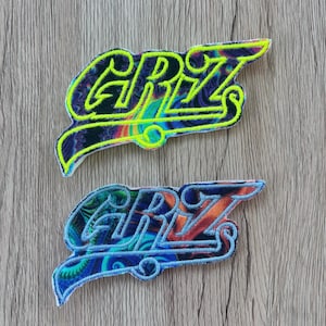 Parche que brilla en la oscuridad con el logotipo de GRiZ DJ EDM