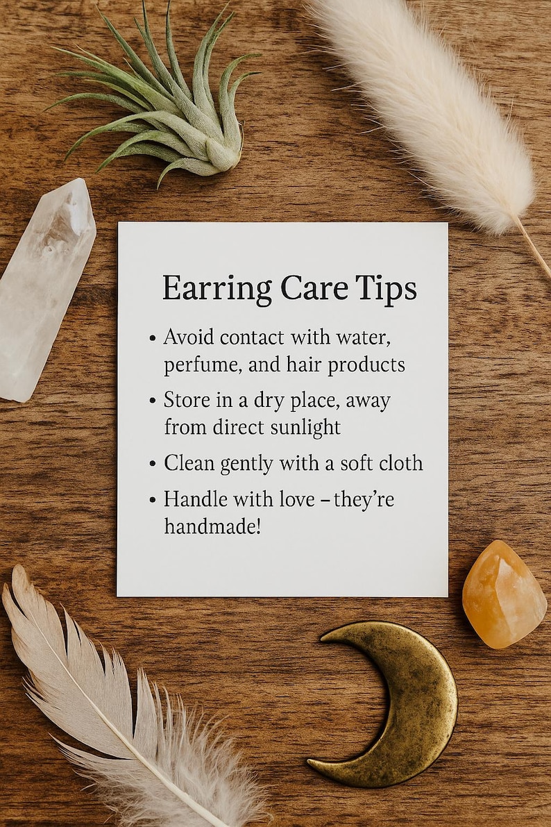 May include: A square white card with black text titled Earring Care Tips. The text lists instructions to avoid water, perfume, and hair products, store in a dry place away from sunlight, clean with a soft cloth, and handle with care.